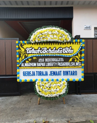 Papan Bunga Duka di Watumalang